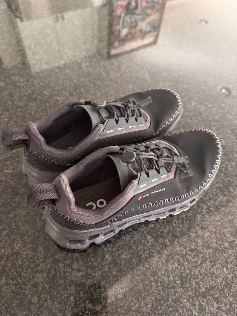 On Running Women's Athletic Shoes - black and water resistant.